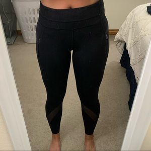 Lululemon 7/8 legging with mesh detail, vertical front zippers. Mid rise waist.